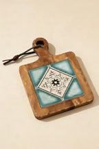 Close-up of the Azure Geometry blue tile inlay and glowing natural acacia wood