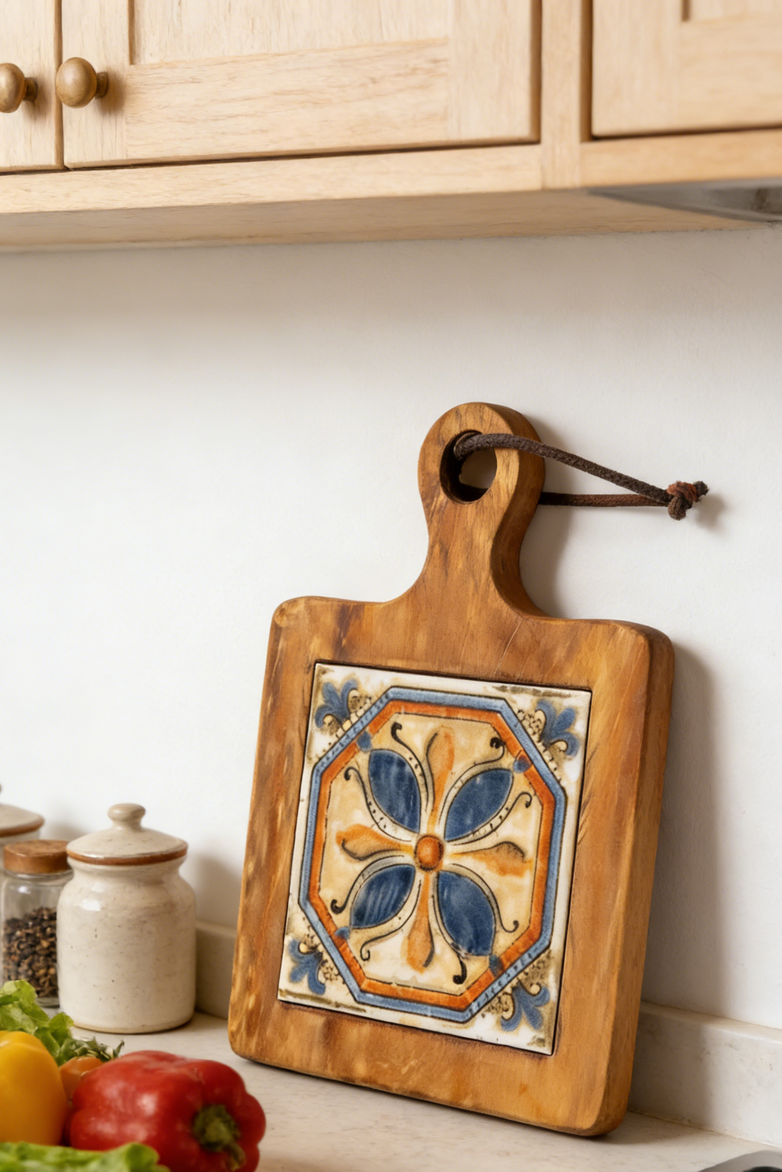 Handcrafted acacia serving board used as a decorative coaster for an elegant afternoon tea setting