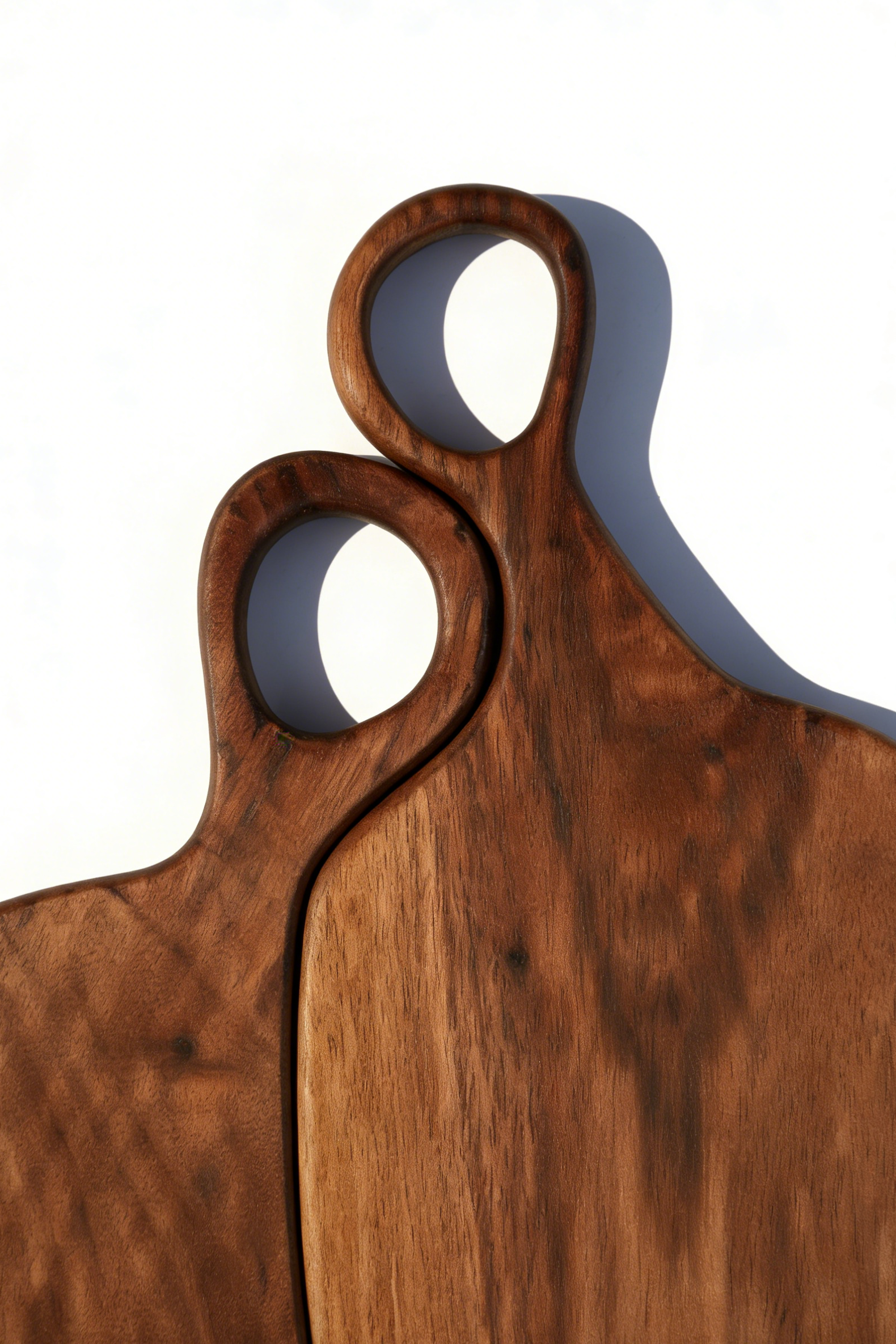 Two-piece walnut cutting board set: 38x20cm large and 30x20cm small prep boards with hanging loops