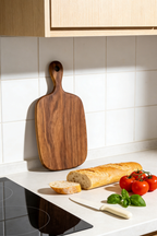 Sustainable Burmese teak wood texture showing radiant golden grain and food-safe finish