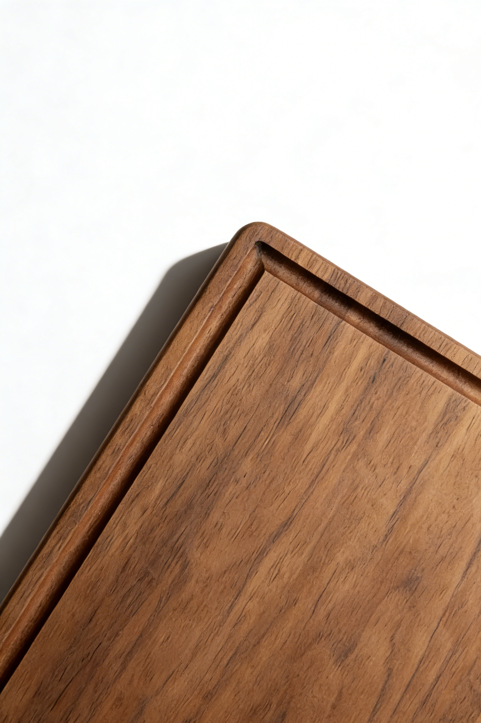 Close-up of the functional juice groove on a GrainGlow walnut board to keep kitchen counters clean